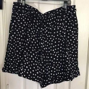Black shorts with white polka dot cuffed shorts